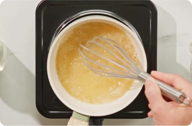 Add stock. Whisk. 