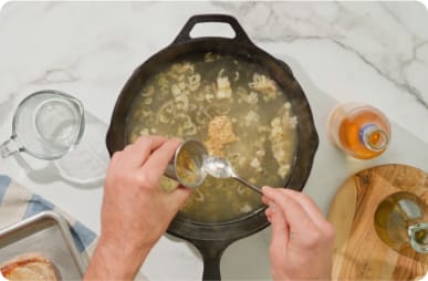 Add stock and ground mustard.